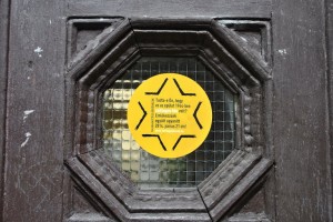 Stickers on Budapest's old Yellow-Star houses